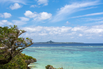 Fototapeta na wymiar Beautiful ocean view with blue sky and Ie island, Okinawa, Japan