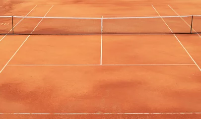  Clay tennis court with net and white markings © Zarya Maxim