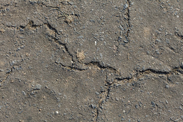 Grey clay, concrete wall with cracks