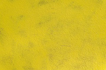 Yellow grunge texture cement wall. copy space