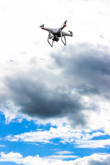 quadrocopter flying against the blue sky