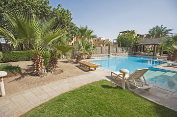 Swimming pool at at luxury tropical holiday villa resort
