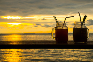 Fresh coctails with a tropical paradise beach with sunset in the Koh Samui Island in Thailand