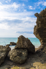 Fototapeta na wymiar Beautiful ocean coast and rocks view from beach, Okinawa Japan.