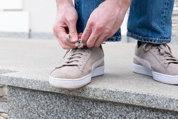 Men's hands tying laces ready for walking