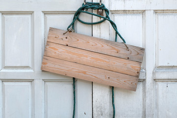 wooden signboard on the door