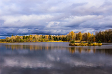 autumn landscape, blue sky,yellow the forest and the lake 