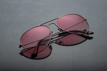 Pink sunglasses.