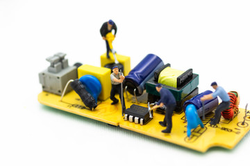 Obraz premium Miniature worker repairing mainboard, clear virus computer and repair, security and technology concept.