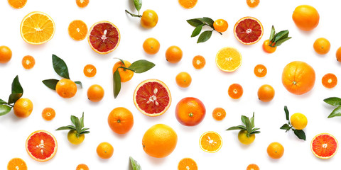 Food texture. Seamless pattern of fresh fruit tangerines and orange isolated on white background, top view, flat lay.