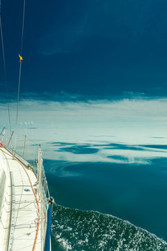 Fototapeta Yachting on sail boat during sunny weather