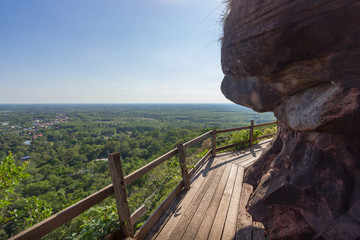 Beautiful scenery of  wooden pathway along the cliff with blue sky and wild in the background, Phu Thok, Bueng Kan, Thailand