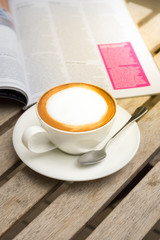 Hot coffee with magazine book.
