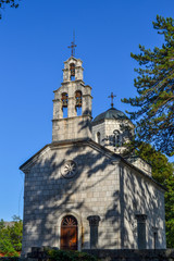 Fototapeta na wymiar A small temple against the sky. Montenegro Orthodox Church