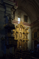 Altarpiece lightened by a beam of sunshine in the baroque church of the Society of Jesus, Arequipa 