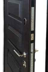 Open armored door. Door lock, Dark brown door closeup. Modern interior design, door handle. New house concept. Real estate.