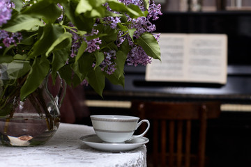 Bouquet of lilac and a cup of tea./Flower, Tea - Hot Drink, Picture Frame, Lilac - Flower, Tea Cup