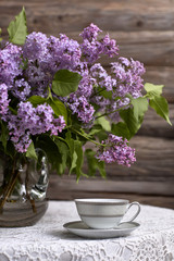 Bouquet of lilac and a cup of tea./Flower, Tea - Hot Drink, Picture Frame, Lilac - Flower, Tea Cup