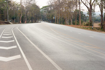 Fototapeta premium road up hill to the mountain top at at sunny sunset.