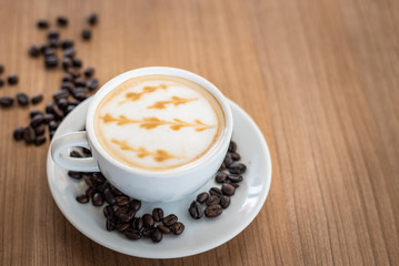 Hot coffee with art pattern in white cup