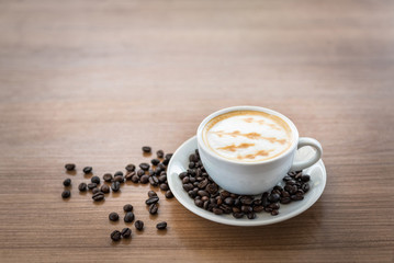 Hot coffee with art pattern in white cup