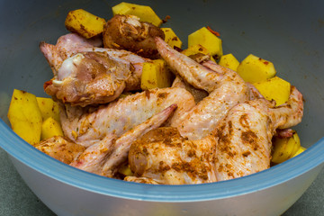 Marinated chicken wings with potatoes