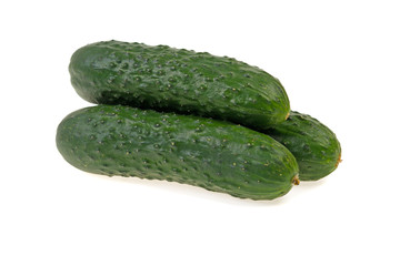 three green ripe cucumber on white background