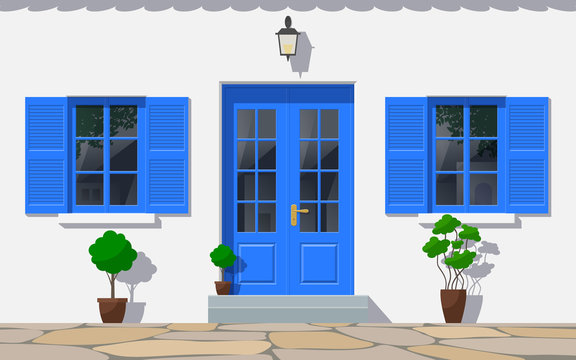 traditional greek house facade with double door and windows front view