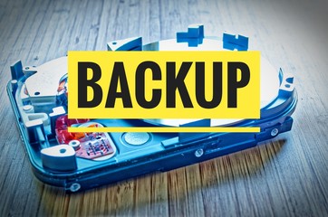 Hard drive 3.5 inches as a data storage with motherboard on a bamboo table and Backup