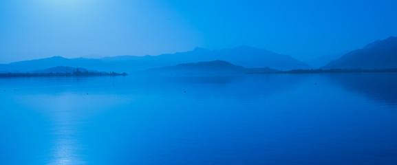 Foggy morning landscape on the shores of the Obersee (Upper Lake Zurich) , Switzerland