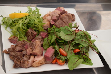 well cooked meat with vegetables on a plate