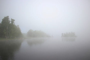 foggy lake and a fog covered island 