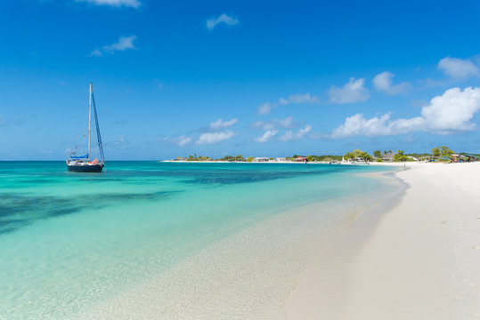 Anchored sailboat on the beautiful water of Los Roques archipelago, in Venezuela