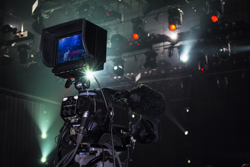 Professional digital video camera. accessories for 4k video cameras. tv camera in a concert hall.
