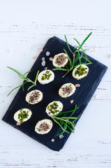 Mini appetizers from soft cheese with spices
