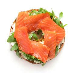 top view of bagel sandwich with salmon isolated on white background