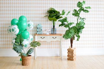Decorations for birthday party. Decorations in Botanical style. A lot of balloons green color. 