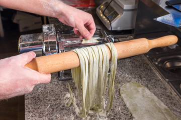 Chef cooking italian spaghetti at the restaurant