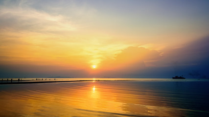 Beautiful nature landscape of big passenger boat on the sea. And colorful of the sunset sky at Nathon Beach Viewpoint, Ko Samui island, Surat Thani, Thailand, 16:9 widescreen