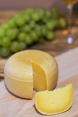 Holland hard cheese on a wooden board