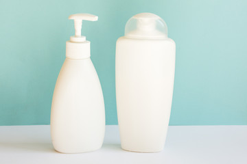 Blank plastic bottles on pastel modern interior. Hygiene cosmetic concept.