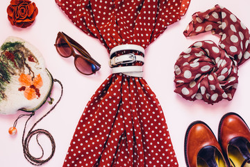 Trendy polka dot pattern print in vintage clothes collage on pink background. Flat lay. Top view © Mr. Music