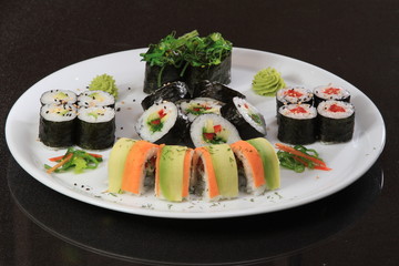 A large set of sushi rolls