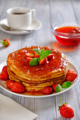 Pancakes with strawberry jam.