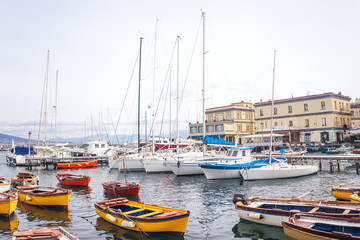 Fototapeta premium Fishermen boats and yachts in Borgo Marinari, harbor of Megaride island in Naples, Campania, Italy, Europe