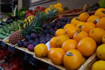 Street market with seasonal tasty fruits and sweets