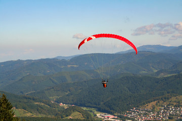 The paratrooper descends to the ground