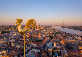 Amazing aerial view of the sunset over Old town of Riga, Vecriga in Latvia. River Daugava, with...