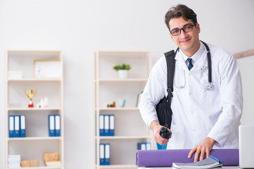 Doctor going to gym during lunch break