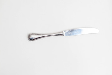 Single knife on white background in a studio